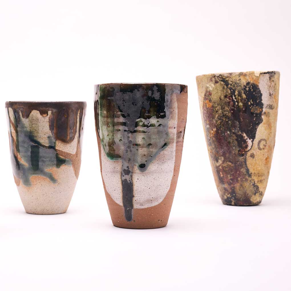 Georgie Vozar, Selection of drinking Vessels, 2022, wild clay slip, copper, hand thrown. Photography by Remi Chauvin