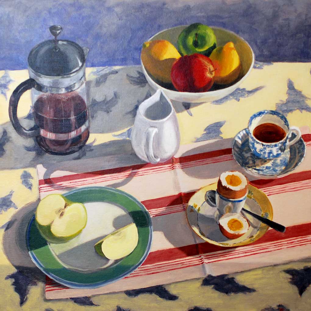 A paintings of a breakfast table setting seen from above. The table is covered with a yellow and blue patterned tablecloth and a red and shite placemat crossed the table diagonally. On the table sits a coffe plunger, a white milk jug, a white bowl of fruit (two lemons, one red apple and one green apple), a blue and white pattern china teacup and saucers, a yellow plate with an egg cup and a hard-boiled egg cut in half, and a green plate with an apple sut in half and slices again.