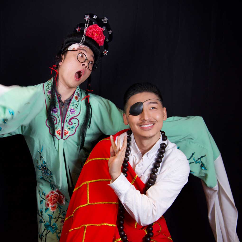 Two actors in theatrical, traditional Chinese costume.